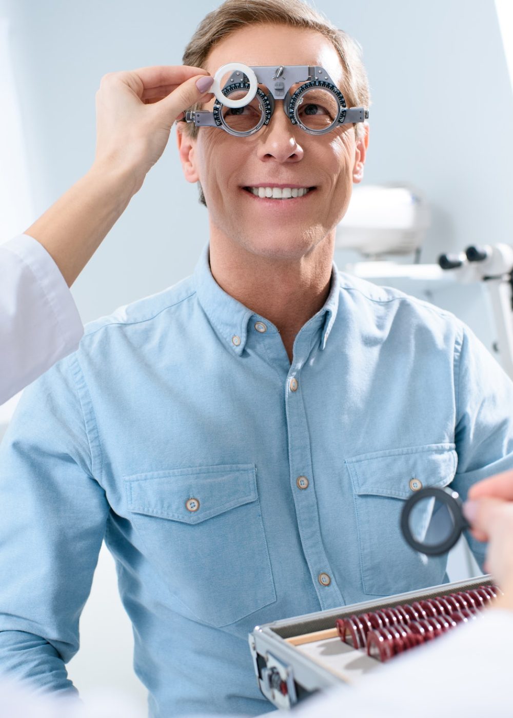 ophthalmologist-examining-middle-aged-man-eyes-with-trial-frame-and-lenses.jpg ophthalmologist-examining-middle-aged-man-eyes-with-trial-frame-and-lenses.jpg