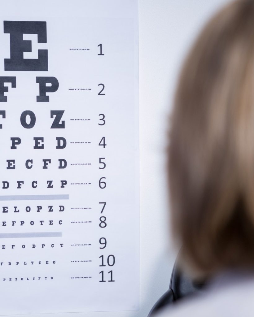 optometrist-looking-at-eye-chart.jpg optometrist-looking-at-eye-chart.jpg