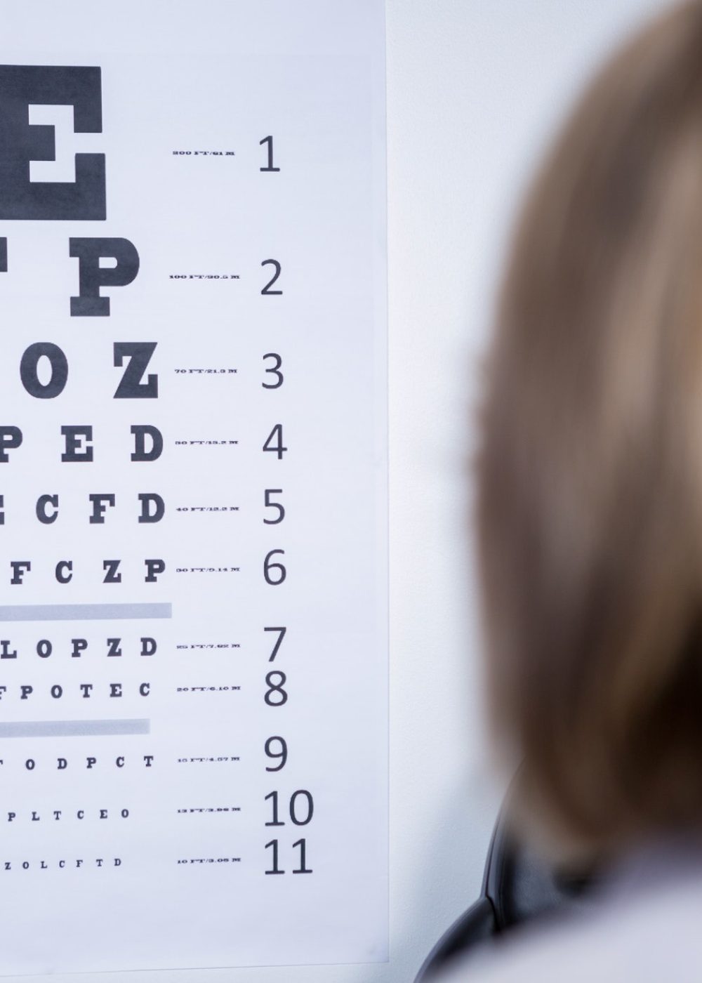 optometrist-looking-at-eye-chart.jpg optometrist-looking-at-eye-chart.jpg