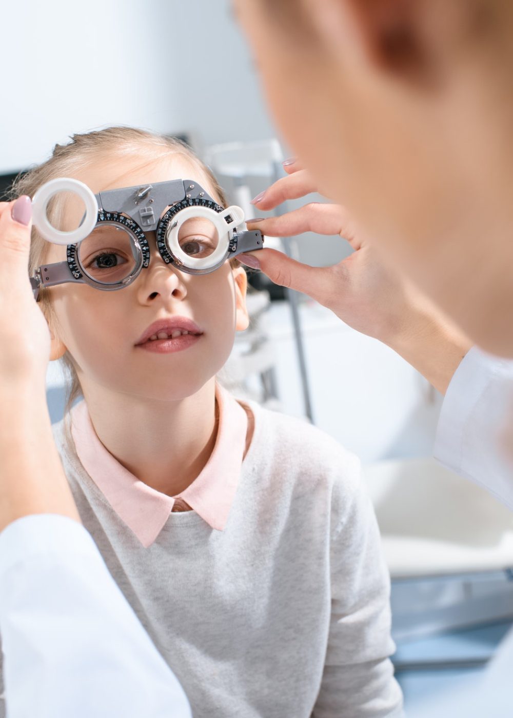 selective-focus-of-ophthalmologist-examining-kid-eyes-with-trial-frame-in-clinic.jpg selective-focus-of-ophthalmologist-examining-kid-eyes-with-trial-frame-in-clinic.jpg